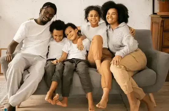 Family of 5 sitting on couch